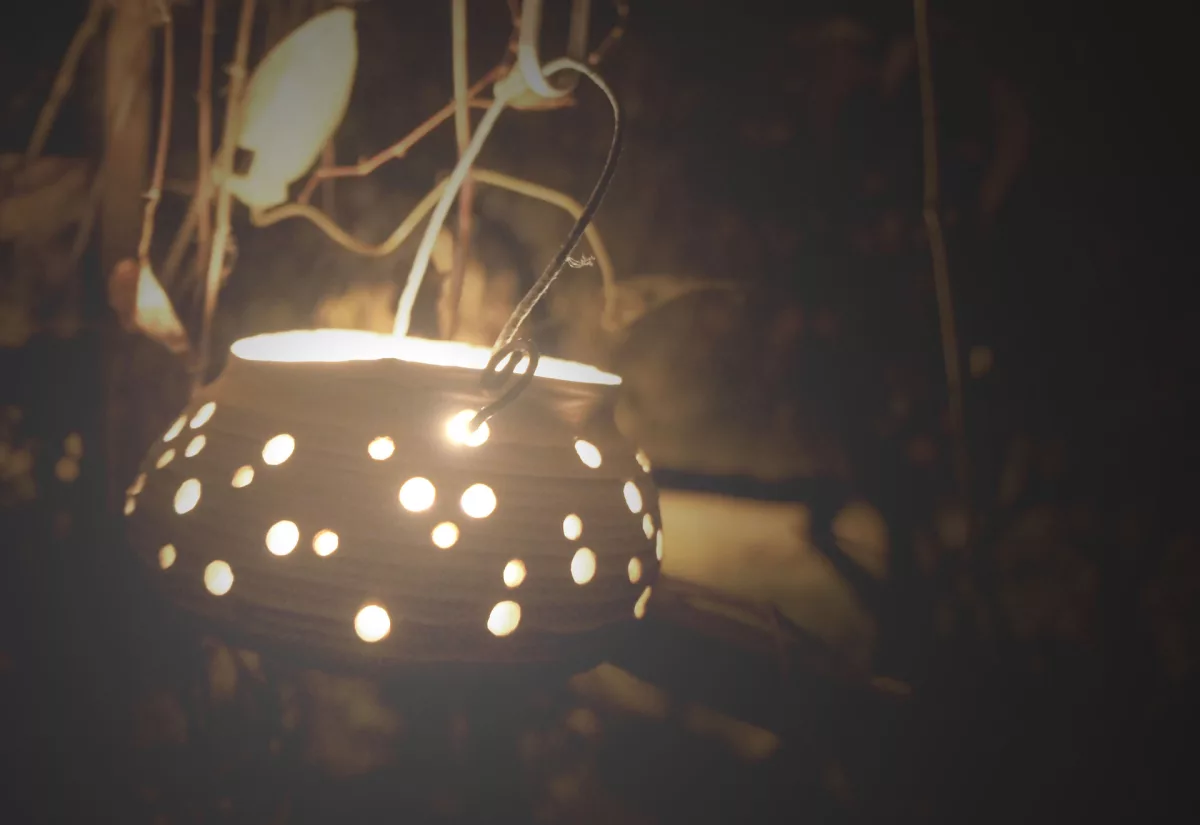 Candle pot glowing in the evening