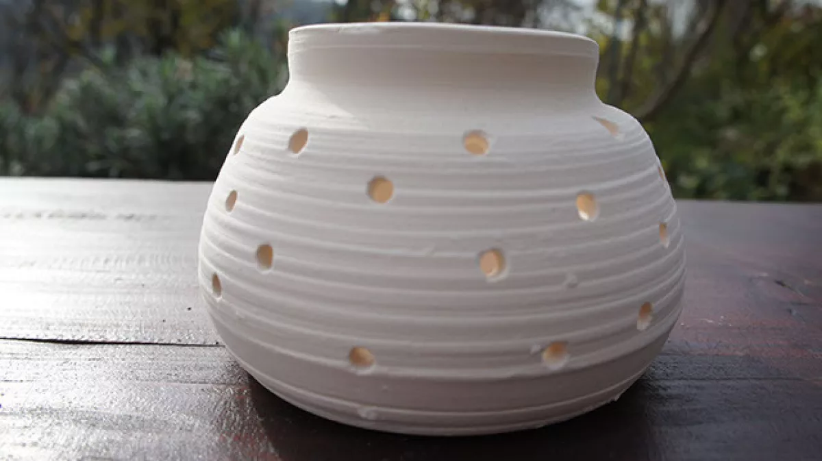 White candle pot with holes
