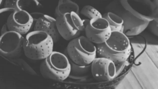 A bowl full of pots, black and white