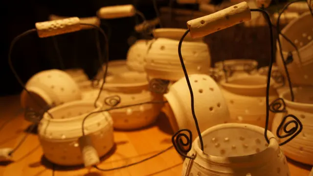 Pots with wire handles in warm light